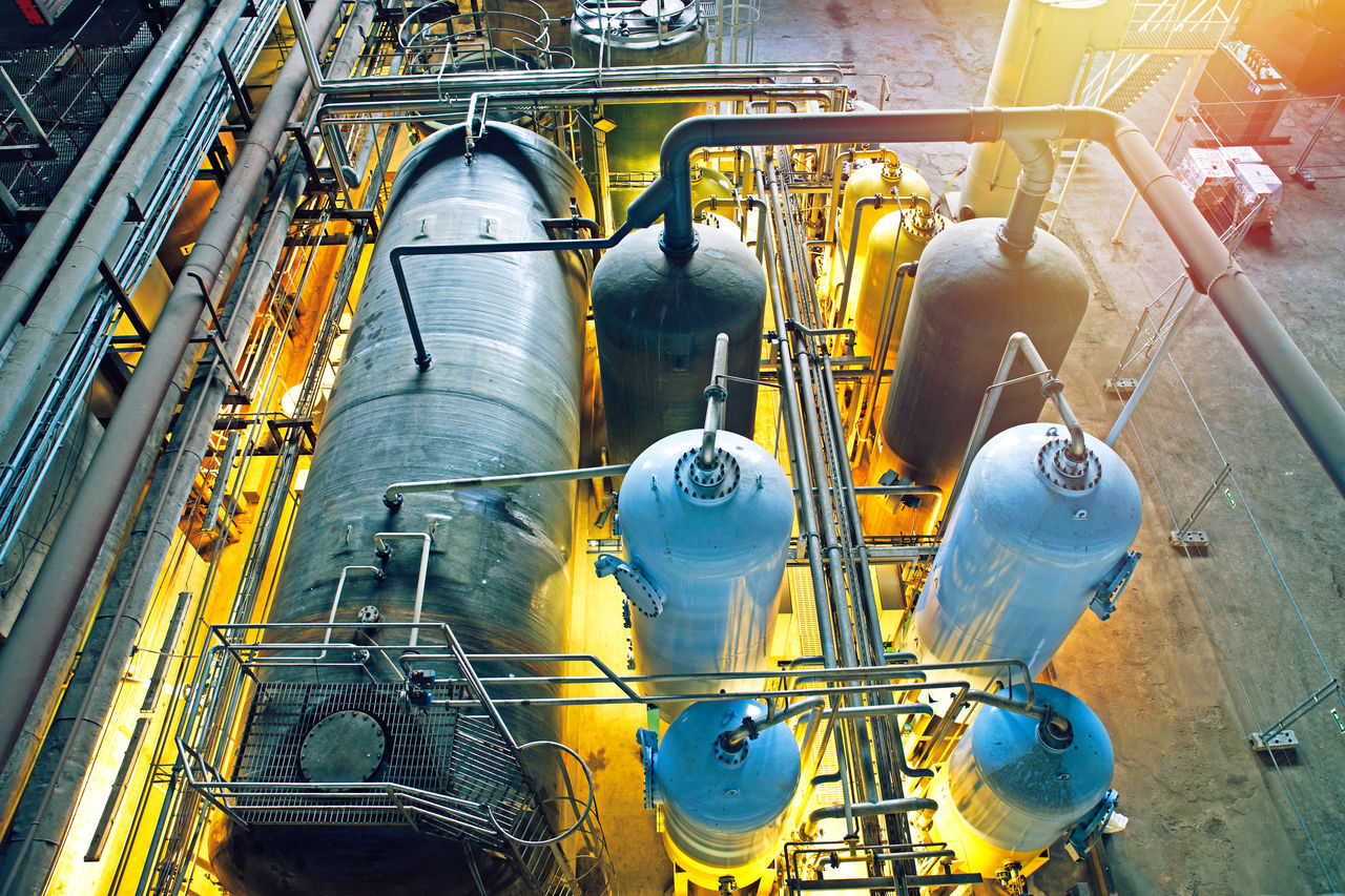 Industrial tanks and pipes in manufacturing facility