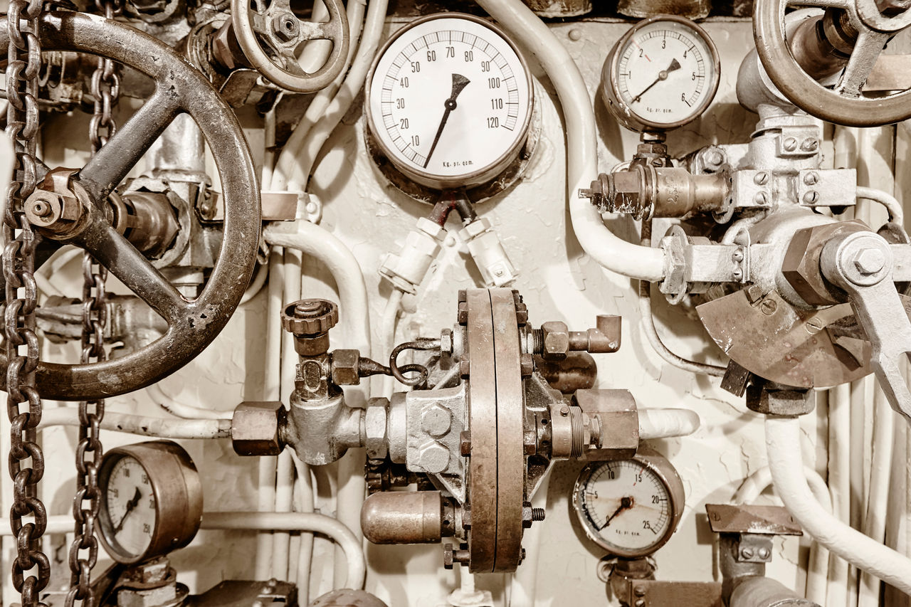Industrial pressure gauges and valve machinery close-up