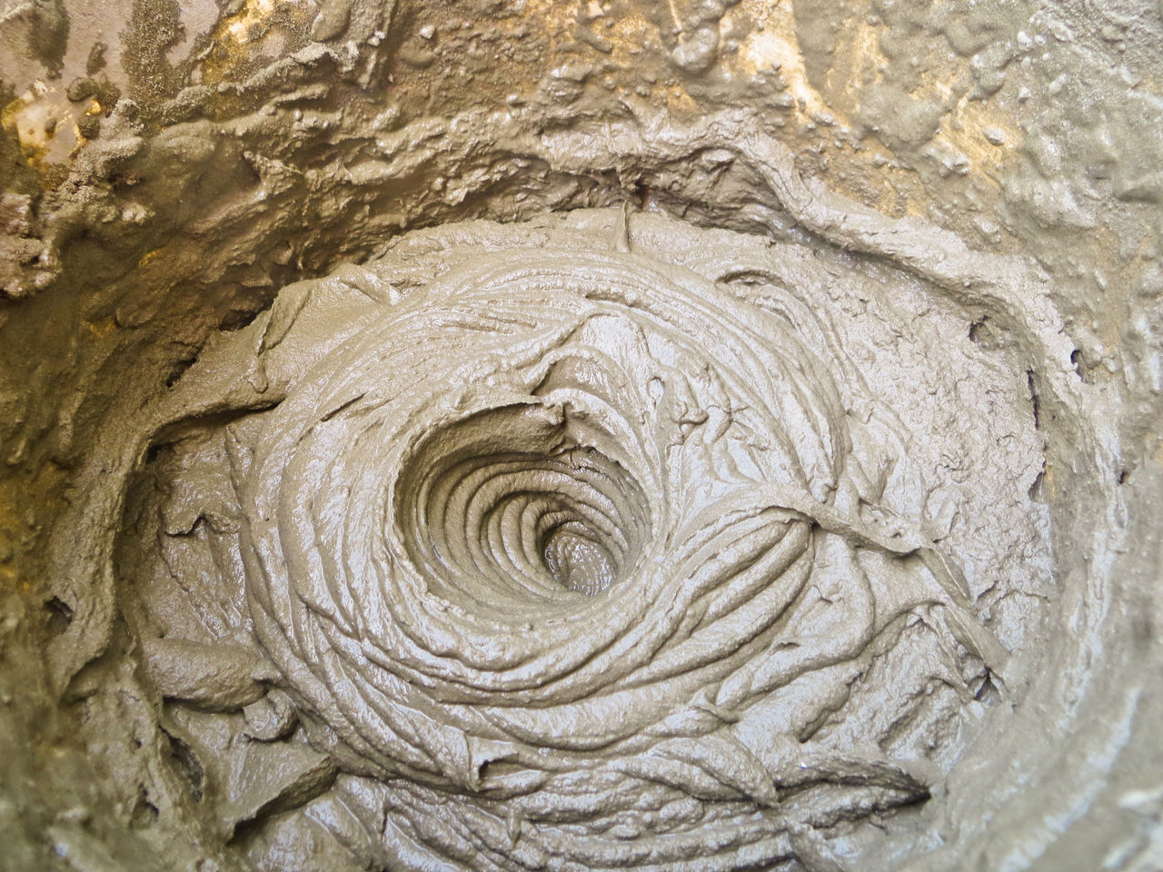 Freshly mixed wet concrete in swirling pattern